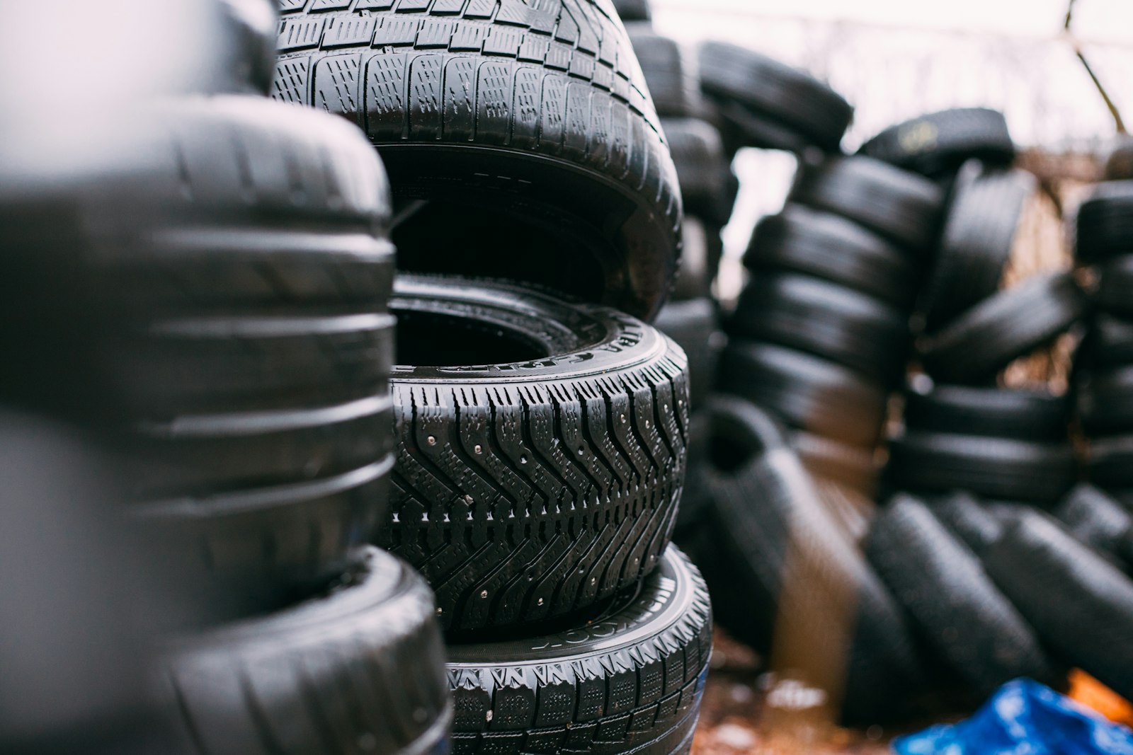 Stacks of tires outside the shop