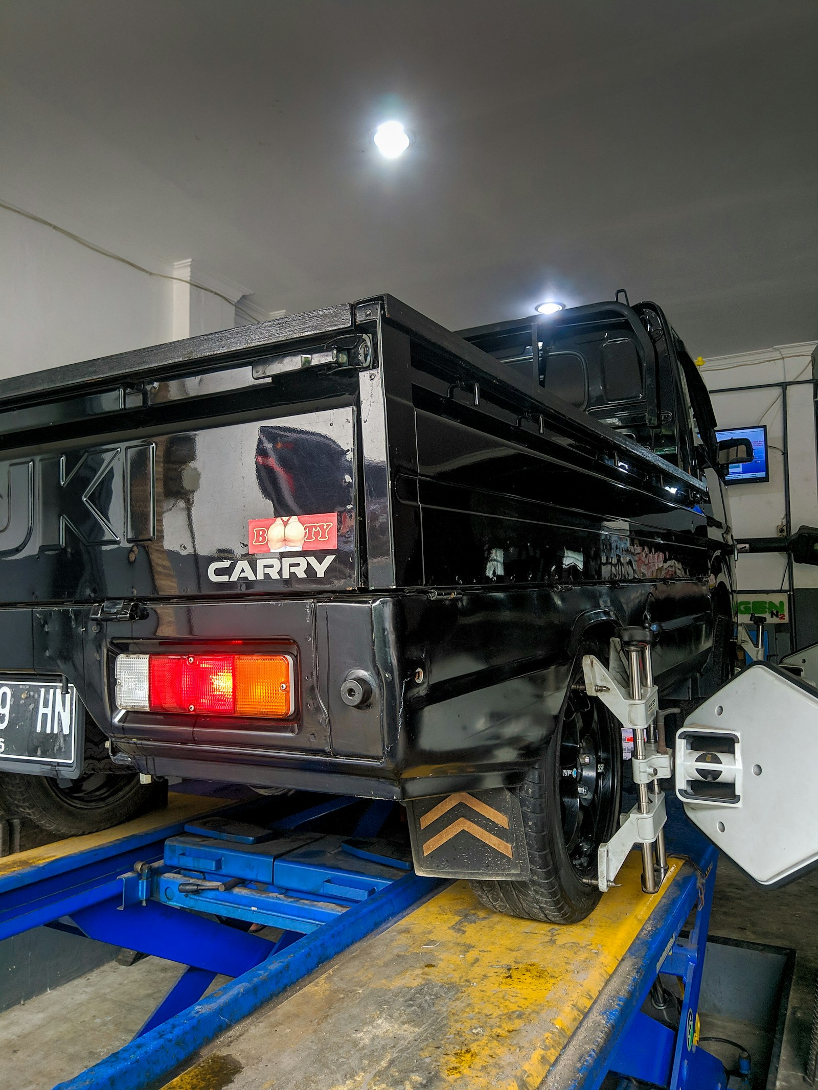Truck on an alignment rack in the shop